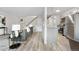 A cozy living room blends into the kitchen area, complete with stylish decor and modern flooring at 7700 W Glasgow Pl # 10A, Littleton, CO 80128