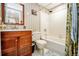 Clean bathroom featuring a vanity with storage, a toilet, and a shower over tub perfect for daily routines at 8624 S Doubleheader Ranch Rd, Morrison, CO 80465