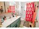 Bathroom featuring a vanity, a toilet, and a bathtub and shower combination at 8624 S Doubleheader Ranch Rd, Morrison, CO 80465