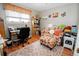 Bedroom features a desk, a chair, a bookshelf, and warm decor at 8624 S Doubleheader Ranch Rd, Morrison, CO 80465