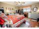 A cozy bedroom showcasing warm lighting, an electric fireplace, and comfortable furnishings at 8624 S Doubleheader Ranch Rd, Morrison, CO 80465