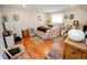Comfortable bedroom featuring a double bed, natural light, hardwood floors, and tasteful decor at 8624 S Doubleheader Ranch Rd, Morrison, CO 80465