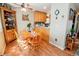 Inviting dining area featuring hardwood floors, a ceiling fan and a charming china cabinet at 8624 S Doubleheader Ranch Rd, Morrison, CO 80465