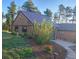 Charming home featuring a metal roof, landscaping, and a manicured lawn at 8624 S Doubleheader Ranch Rd, Morrison, CO 80465