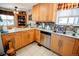 Updated kitchen featuring stainless steel appliances, ample counter space, and a cozy adjacent dining area at 8624 S Doubleheader Ranch Rd, Morrison, CO 80465