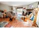 Bright living room with a fireplace, a sliding glass door to deck, wood floors and comfortable seating at 8624 S Doubleheader Ranch Rd, Morrison, CO 80465