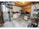 Functional utility room space with essential mechanicals, storage shelving, and ample room for projects at 8624 S Doubleheader Ranch Rd, Morrison, CO 80465