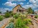 Two story home featuring well-maintained landscaping and a blue sky at 784 Sweet Pine Ct, Monument, CO 80132