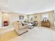 Spacious living room with plush seating, a modern coffee table, and plenty of natural light from the windows at 784 Sweet Pine Ct, Monument, CO 80132