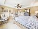 Serene main bedroom with neutral tones, offering a restful ambiance, walk-in closet, and adjoining bath at 784 Sweet Pine Ct, Monument, CO 80132