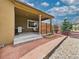 Covered patio featuring a built-in grill and outdoor seating area, perfect for entertaining at 784 Sweet Pine Ct, Monument, CO 80132