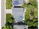 An aerial view of the property showcases the layout of the home, the well-manicured yard and patio spaces at 20789 E Princeton Pl, Aurora, CO 80013