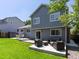 A backyard with a well-maintained lawn and a patio area perfect for outdoor seating and entertaining at 20789 E Princeton Pl, Aurora, CO 80013