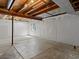 Unfinished basement featuring concrete floors, bright lighting, and white walls at 20789 E Princeton Pl, Aurora, CO 80013