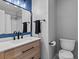 Bathroom showcasing a vanity with a dark hardware and a framed mirror at 20789 E Princeton Pl, Aurora, CO 80013