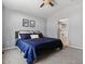 Comfortable bedroom boasts a large window and ensuite access to a bathroom at 20789 E Princeton Pl, Aurora, CO 80013