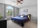 Serene bedroom with large window, ceiling fan, and comfortable furnishings for relaxation at 20789 E Princeton Pl, Aurora, CO 80013