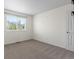 Bright bedroom featuring neutral carpet, a window with blinds, and ample natural light at 20789 E Princeton Pl, Aurora, CO 80013