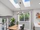 Bright dining room with skylights, hardwood floors, and modern decor at 20789 E Princeton Pl, Aurora, CO 80013