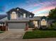 Charming two-story home featuring an attached garage, a manicured lawn, and beautiful landscaping at 20789 E Princeton Pl, Aurora, CO 80013