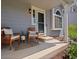 Inviting front porch featuring stylish seating, elegant landscaping, and a welcoming entrance at 20789 E Princeton Pl, Aurora, CO 80013