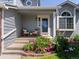Inviting front porch featuring stylish seating, elegant landscaping, and a welcoming entrance at 20789 E Princeton Pl, Aurora, CO 80013