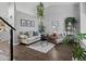 Bright living room with vaulted ceilings, modern decor, and hardwood floors at 20789 E Princeton Pl, Aurora, CO 80013