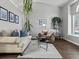 Bright living room with vaulted ceilings, modern decor, and hardwood floors at 20789 E Princeton Pl, Aurora, CO 80013