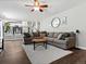 Open living room with a large gray sectional sofa and view to the kitchen at 20789 E Princeton Pl, Aurora, CO 80013