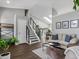 Bright living room with vaulted ceilings, modern decor, and hardwood floors at 20789 E Princeton Pl, Aurora, CO 80013