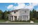 Charming two-story home featuring stone accents, a welcoming porch, and well-manicured landscaping at 24098 E Warm Springs Ave, Aurora, CO 80019