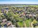 Neighborhood aerial view showcasing a lush park and green space with a walking path at 10957 Bryant St, Westminster, CO 80234