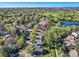 Residential street aerial view with mature trees, green space, and neighborhood at 10957 Bryant St, Westminster, CO 80234