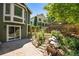 Private backyard showcasing lush landscaping and a charming stone pathway to the home at 10957 Bryant St, Westminster, CO 80234