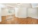 Finished basement with wood-look flooring, mirrored closet doors, and a neutral color scheme at 10957 Bryant St, Westminster, CO 80234