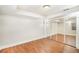 Spacious bedroom with wood flooring, mirrored closet doors, and ample natural light at 10957 Bryant St, Westminster, CO 80234
