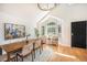Bright dining room featuring hardwood floors, a modern chandelier, and a bay window at 10957 Bryant St, Westminster, CO 80234