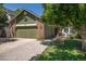 Well-maintained home featuring a two-car garage, beautiful landscaping, and a welcoming entrance at 10957 Bryant St, Westminster, CO 80234