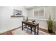 Well-lit home office with decor, plank wall, and hardwood floors, perfect for productivity at 10957 Bryant St, Westminster, CO 80234