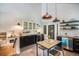 Modern kitchen featuring a breakfast bar, updated appliances, and a cozy atmosphere at 10957 Bryant St, Westminster, CO 80234