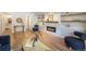 Inviting living room with a modern fireplace and decorative shelving, enhanced by wood floors at 10957 Bryant St, Westminster, CO 80234