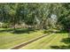 Picturesque park featuring a stream, walking path, and mature trees providing shade at 10957 Bryant St, Westminster, CO 80234