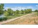 Scenic path leading through natural grasses and trees, perfect for walking or jogging at 10957 Bryant St, Westminster, CO 80234