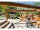 Stylish outdoor pergola with seating area and garden shed surrounded by lush greenery at 10957 Bryant St, Westminster, CO 80234