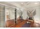Bright studio featuring mirrored closet doors, wooden floors, and a yoga space at 10957 Bryant St, Westminster, CO 80234