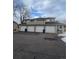 Exterior view of a townhome building with four garages at 12652 E Warren Dr # C, Aurora, CO 80014