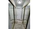 Hallway with mirrored closet doors and wood-look flooring at 12652 E Warren Dr # C, Aurora, CO 80014