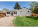 Backyard featuring a fenced in lawn and gravel area at 4197 S Grant St, Englewood, CO 80113
