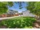 Beautifully maintained backyard with green lawn, gravel area, and privacy fence at 4197 S Grant St, Englewood, CO 80113