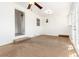 Bedroom with neutral carpet and white walls, ceiling fan, two windows and french door entrance at 4197 S Grant St, Englewood, CO 80113
